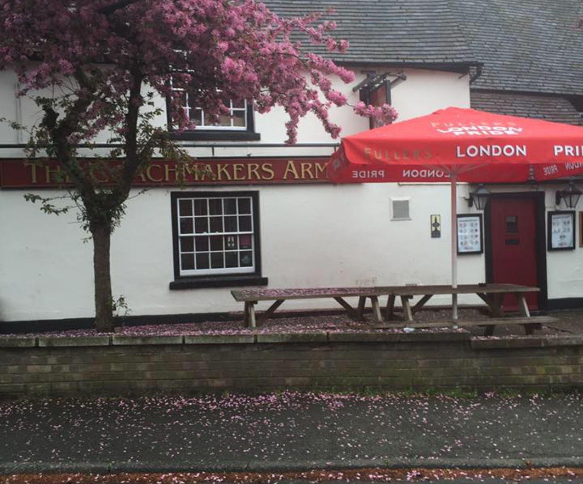 Image of the front of The Coachmakers Arms, willith a blossoming tree