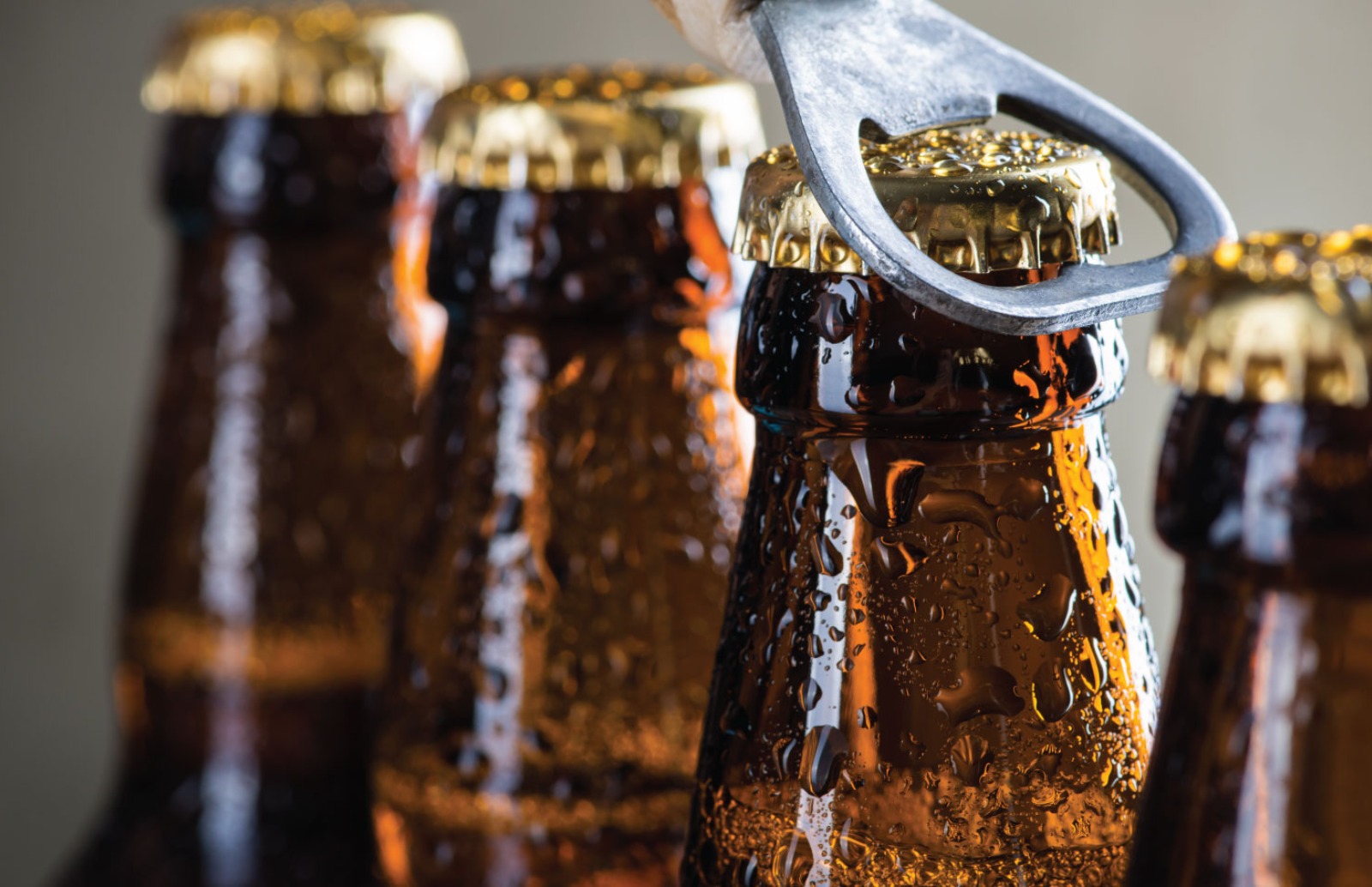 Close up image of bottles, one having the top taken off